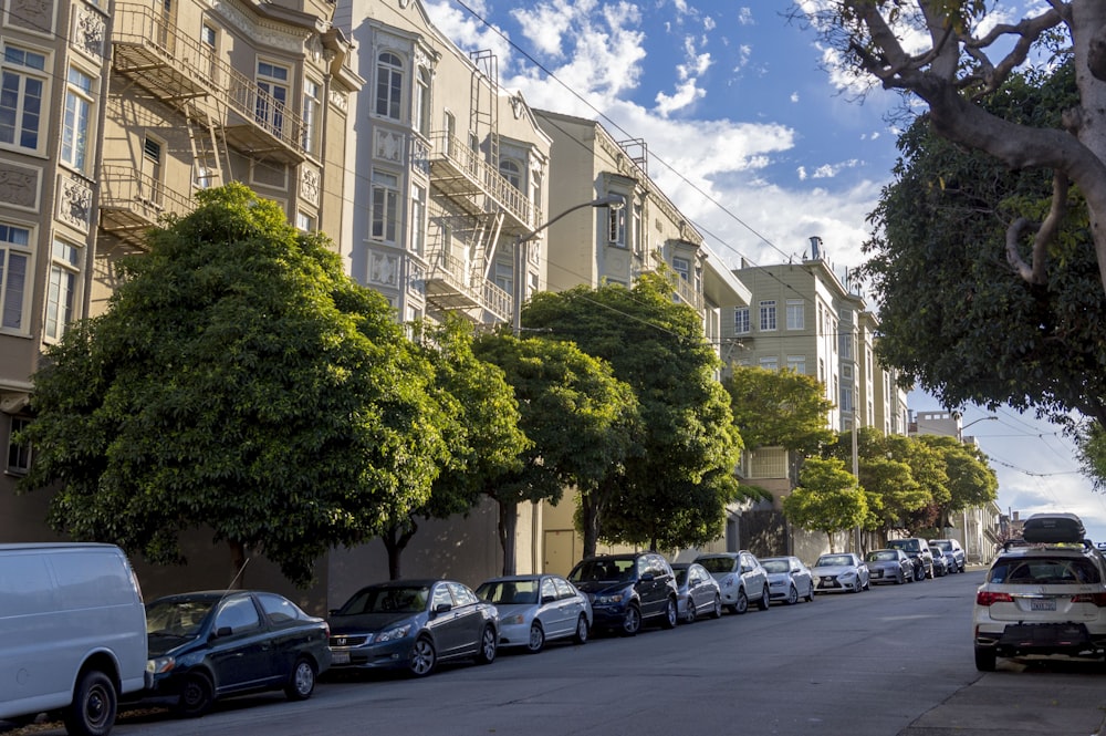 cars parked on parking lot near building during daytime