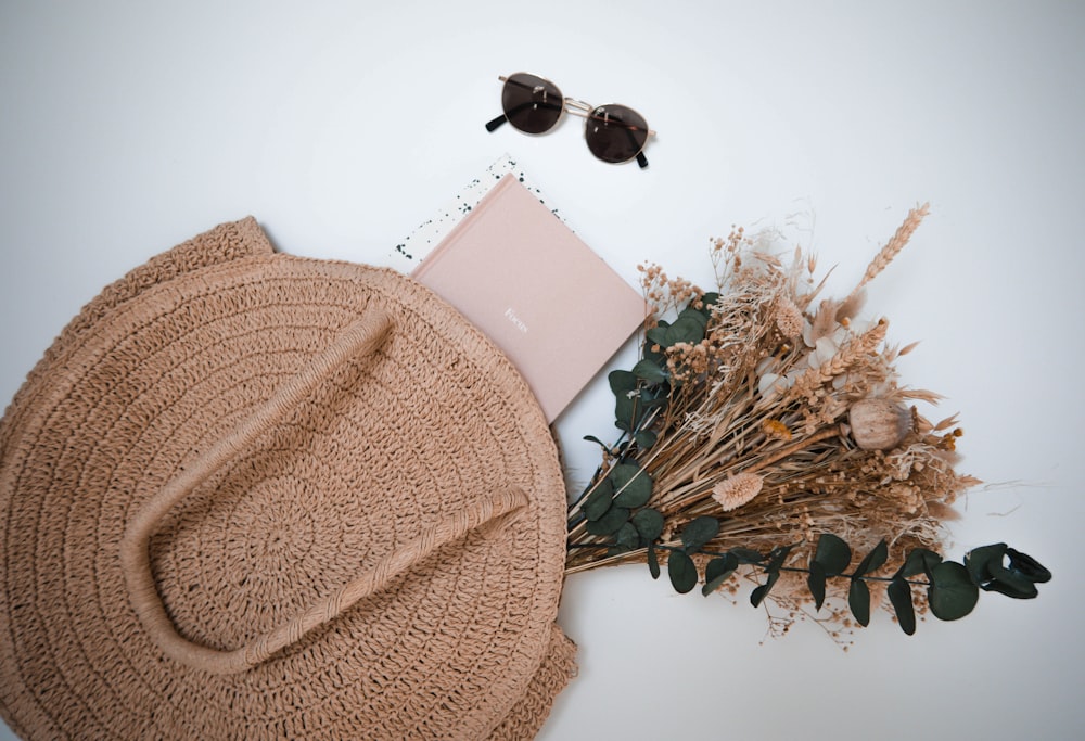 brown knit cap and black sunglasses