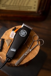 black and silver scissors beside silver scissors