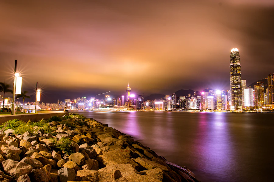 View of Hong Kong illuminated skyline from Victoria Harbour at night