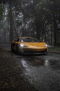 yellow mclaren 750s on road during daytime