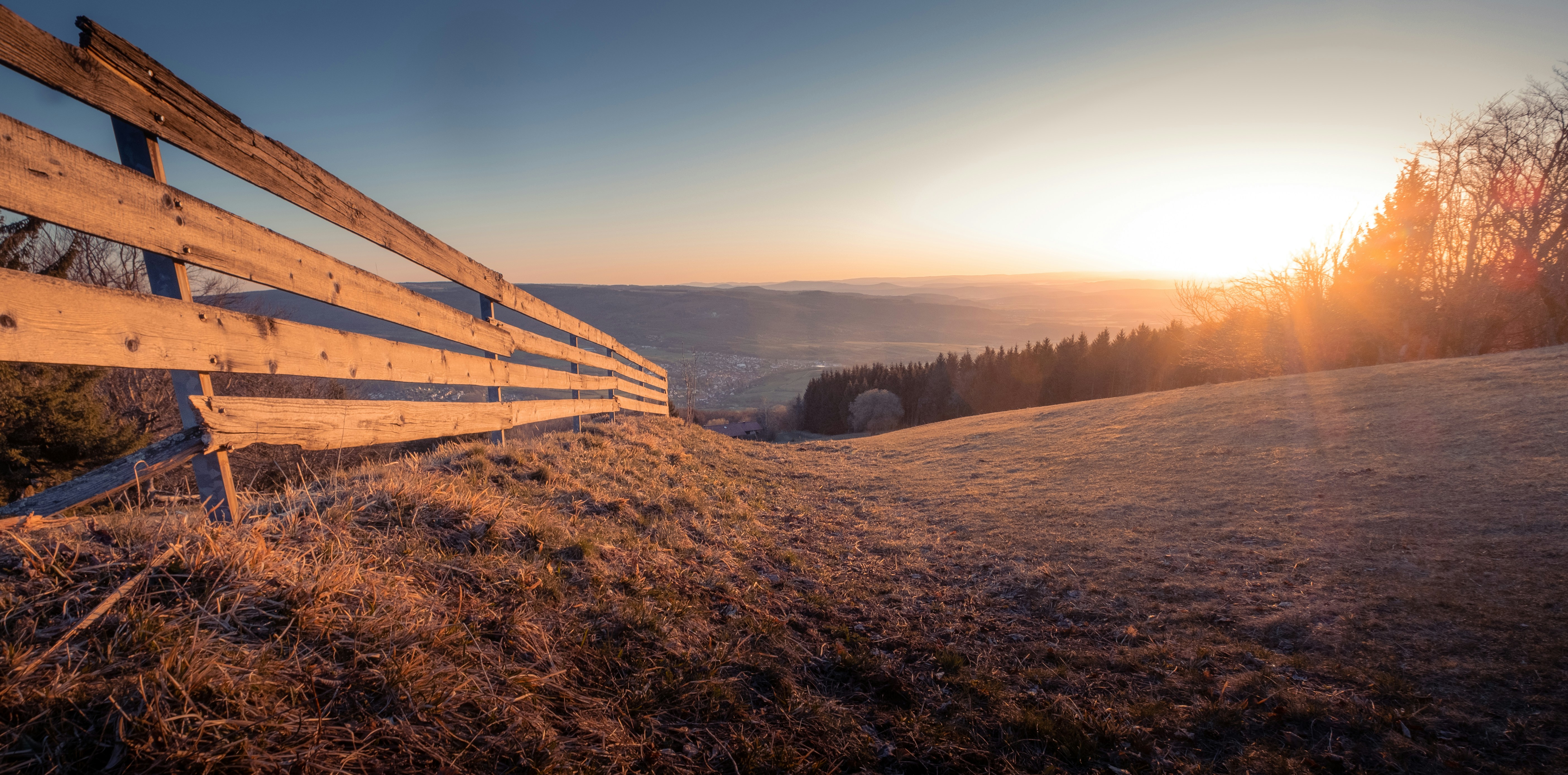 Brown wooden fence on brown grass field during daytime photo – Free ...