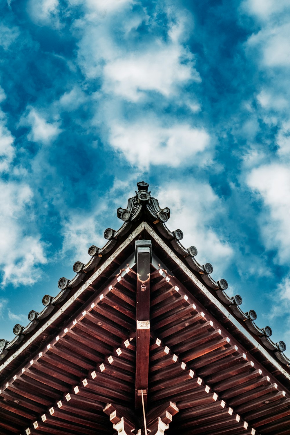 brown wooden roof under blue sky