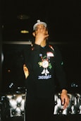 man in black and green zip up jacket
