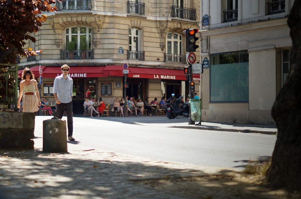 people walking on street near red building during daytime