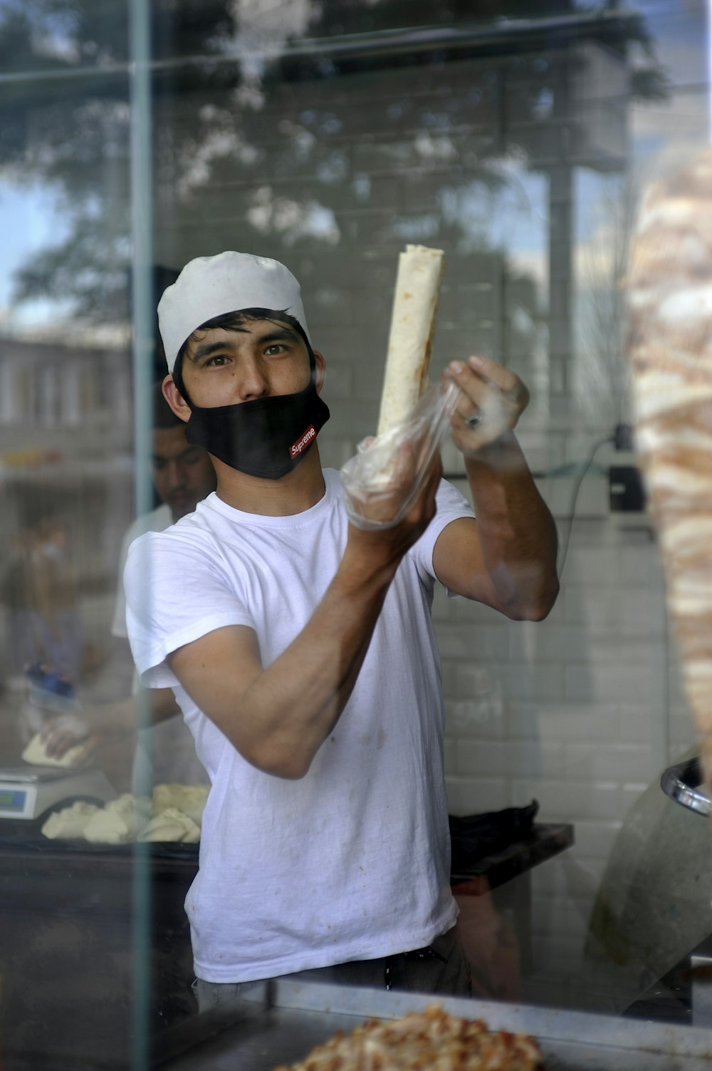 man in white crew neck t-shirt wearing black sunglasses and white cap