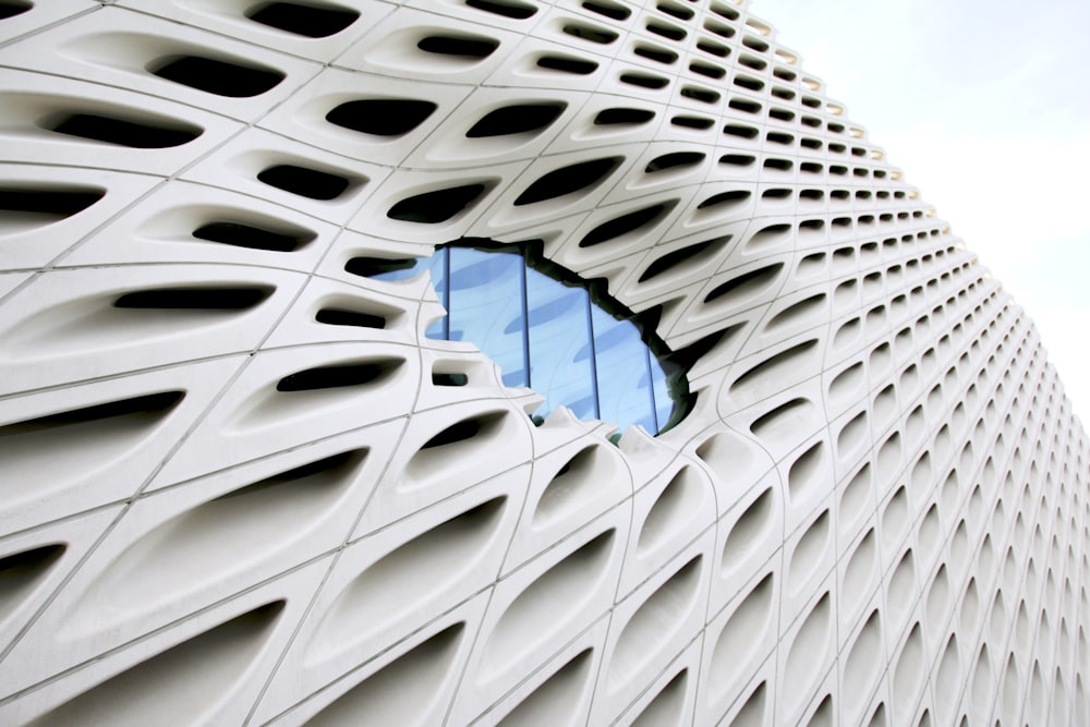 white concrete building with blue round roof