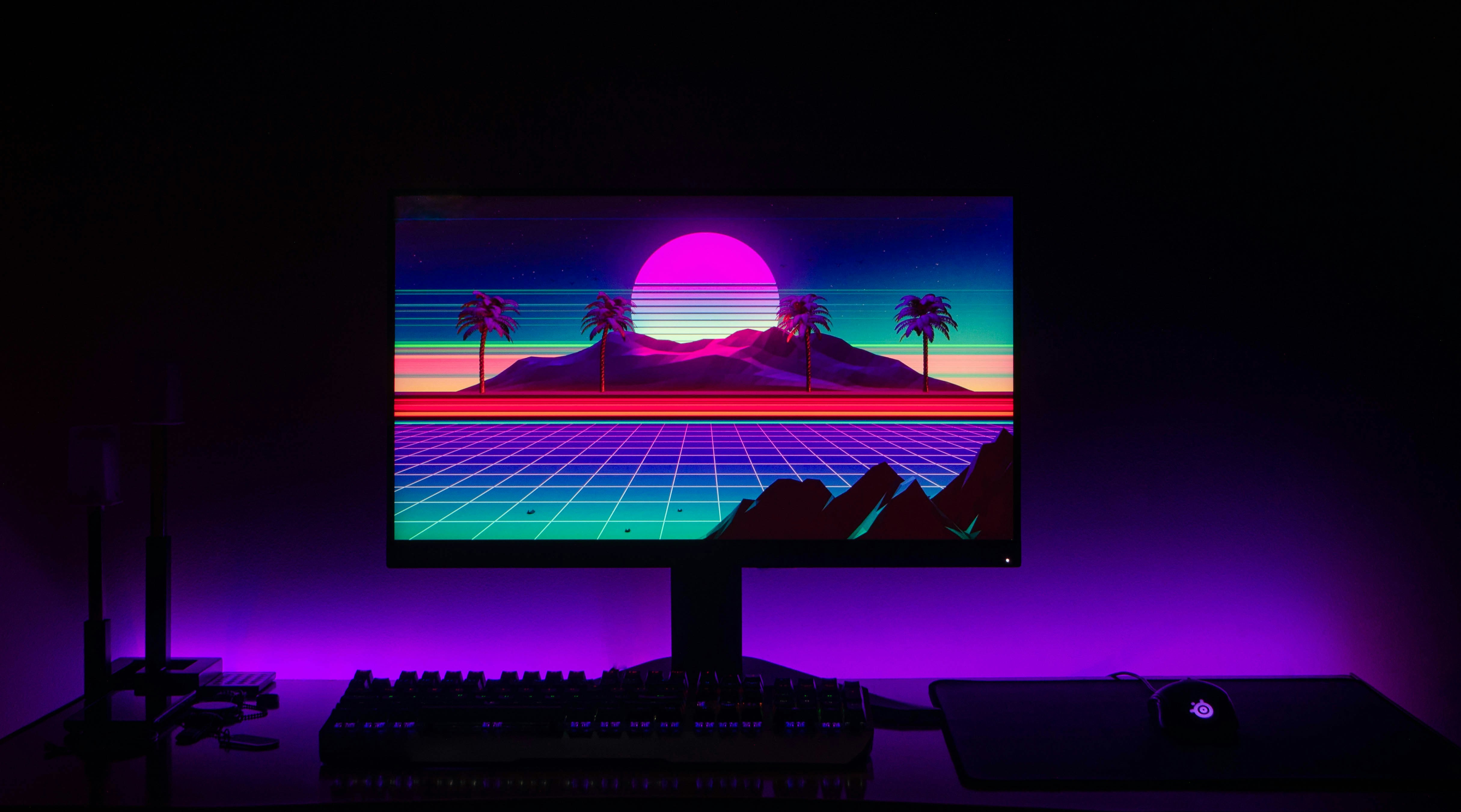 black flat screen computer monitor turned on displaying man in black suit