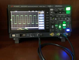 Oscilloscope screen showing waveform patterns from a high-speed interface validation.