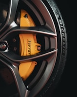 black and yellow 5 spoke car wheel