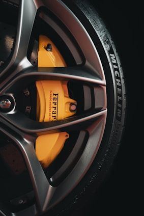 black and yellow 5 spoke car wheel