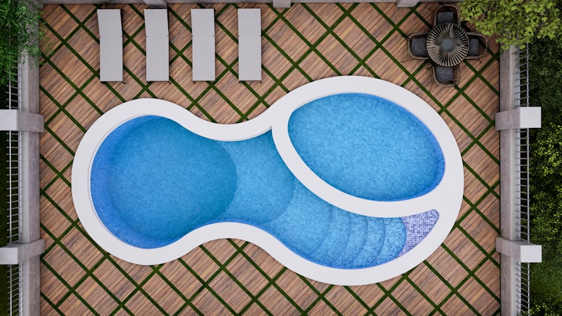 blue and white heart shaped above ground pool