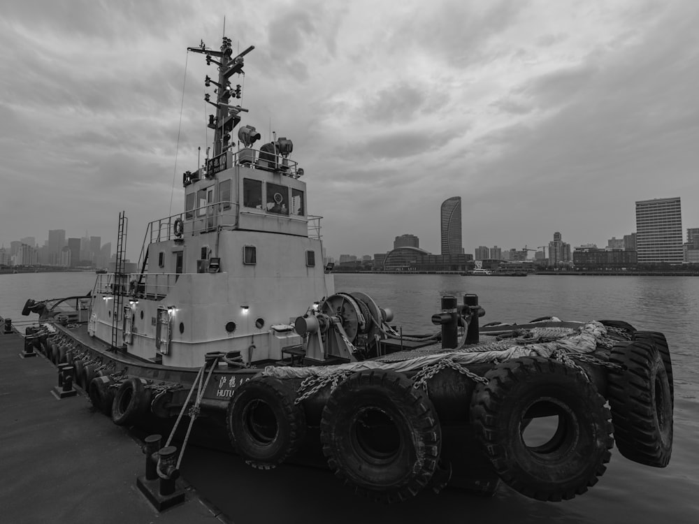 grayscale photo of a boat on a body of water