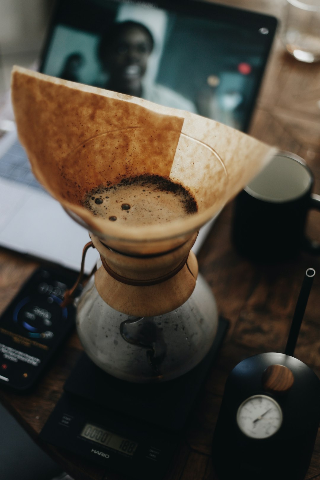 brown ceramic coffee mug on silver saucer