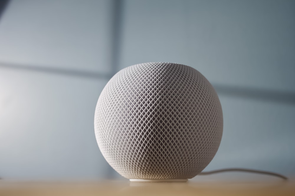 round gray ball on brown wooden table