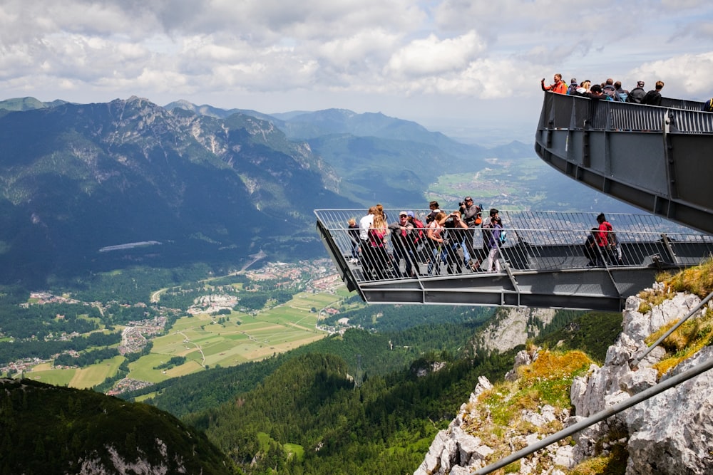 people on top of the mountain during daytime