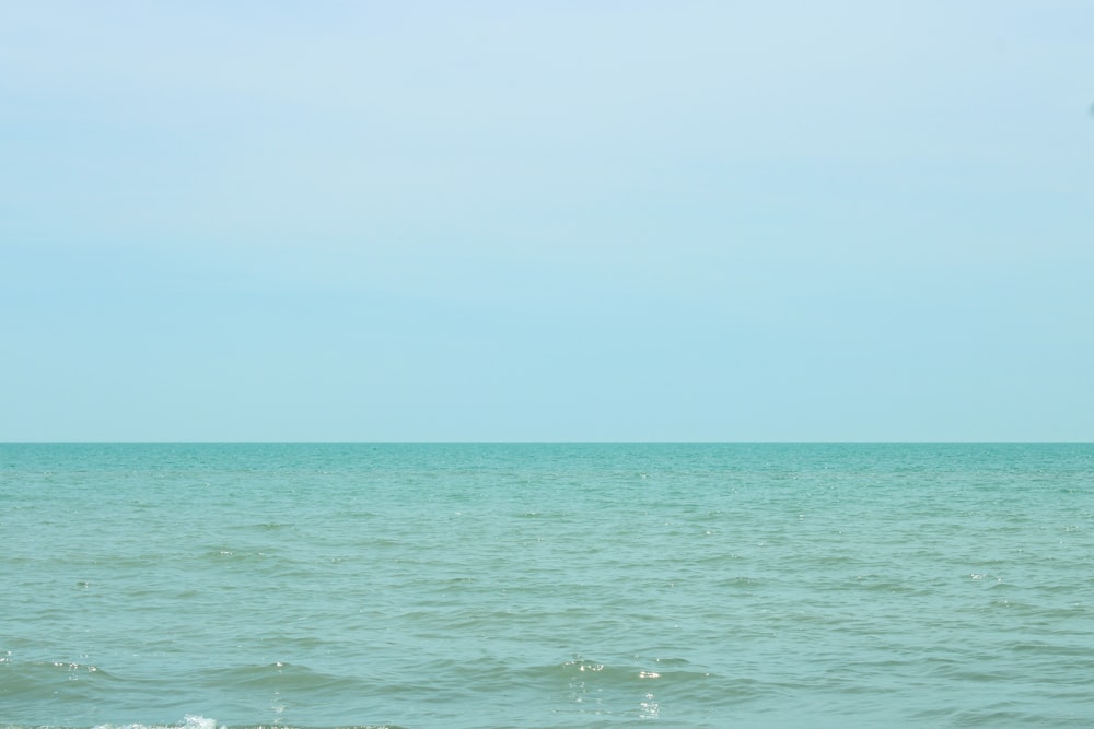 body of water under blue sky during daytime