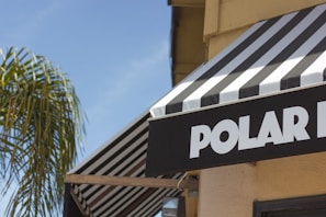 white and black wooden signage