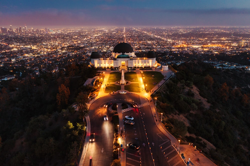 white and black dome building on top of hill during night time