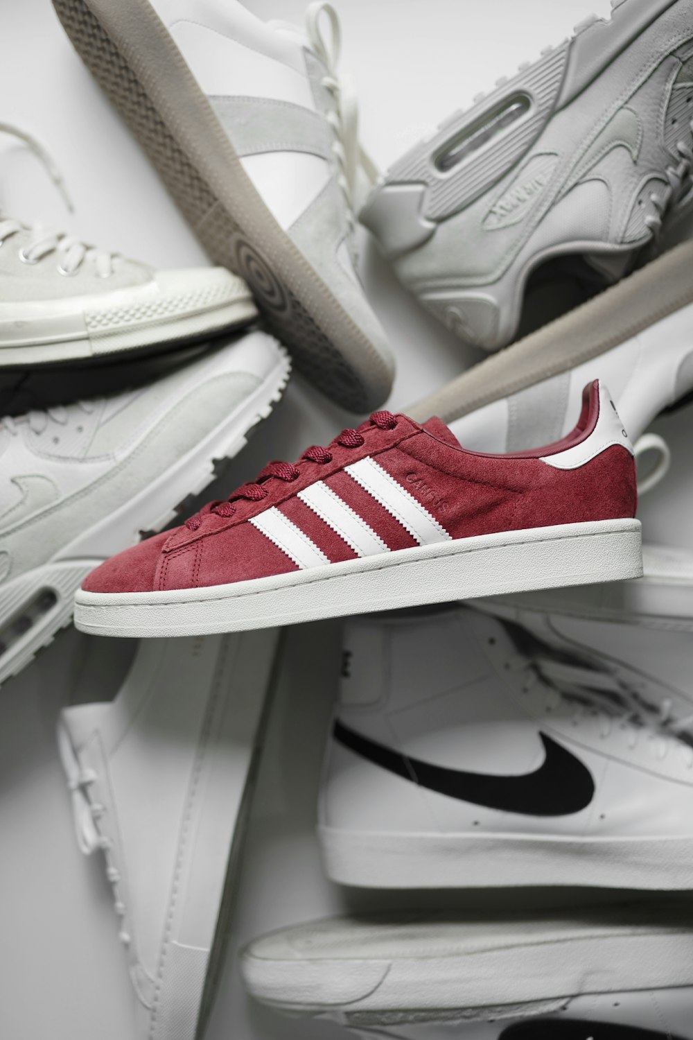 red and white adidas low top sneakers