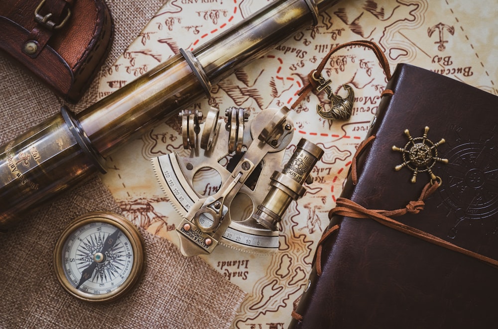 gold and silver skeleton key on brown leather bag