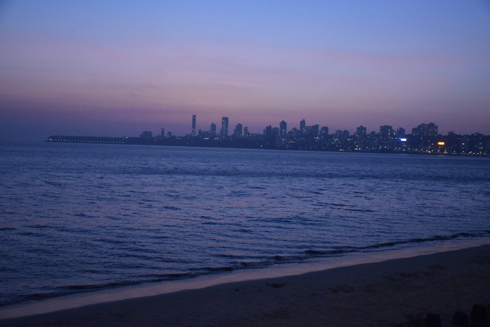 body of water near city buildings during daytime