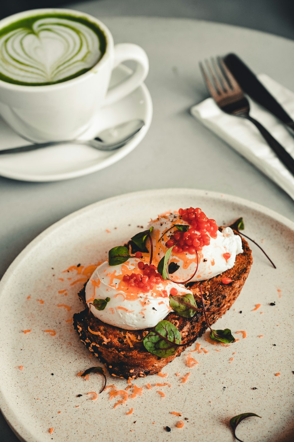 brown bread with white cream on white ceramic plate