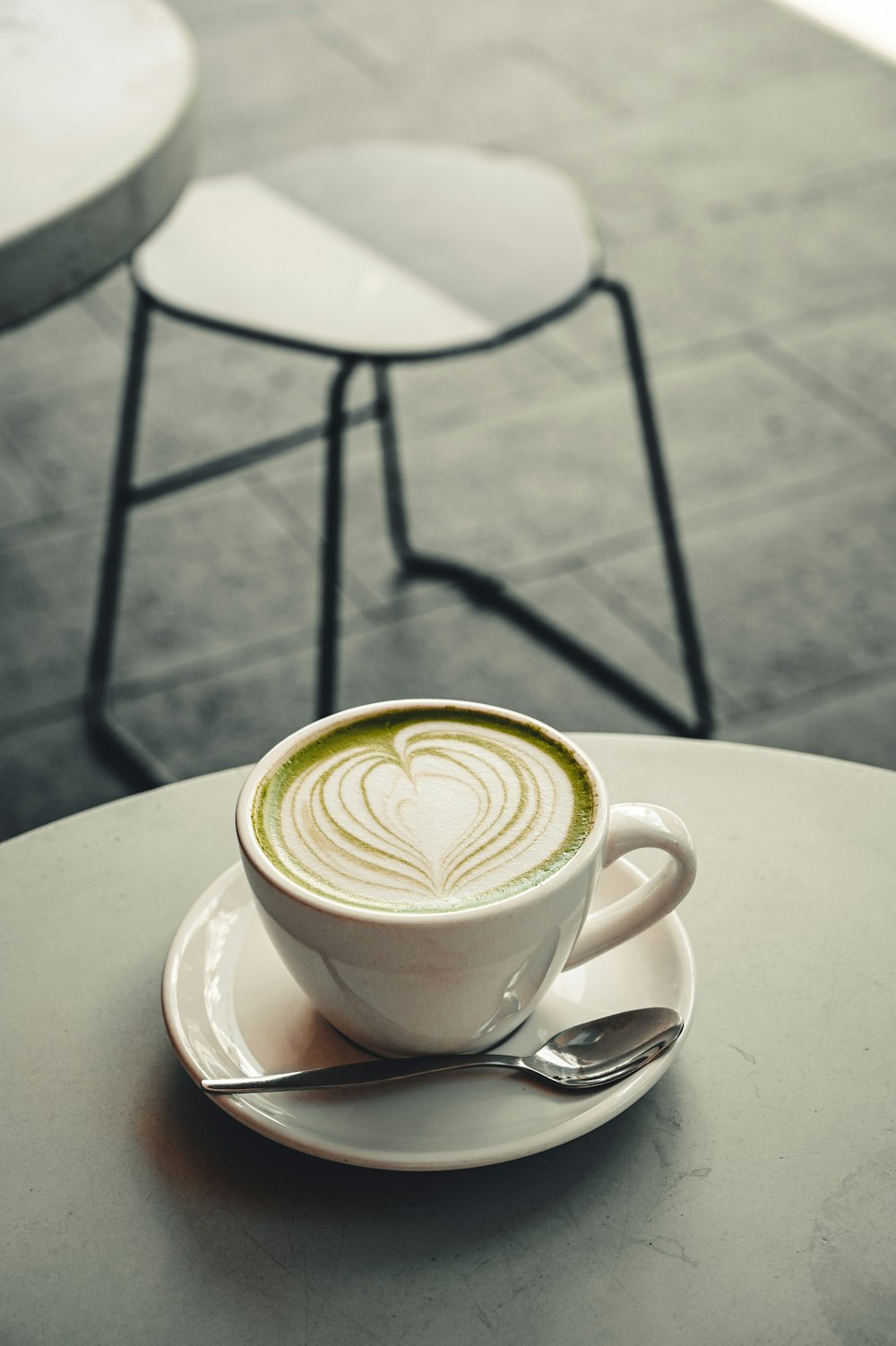 white ceramic cup with saucer