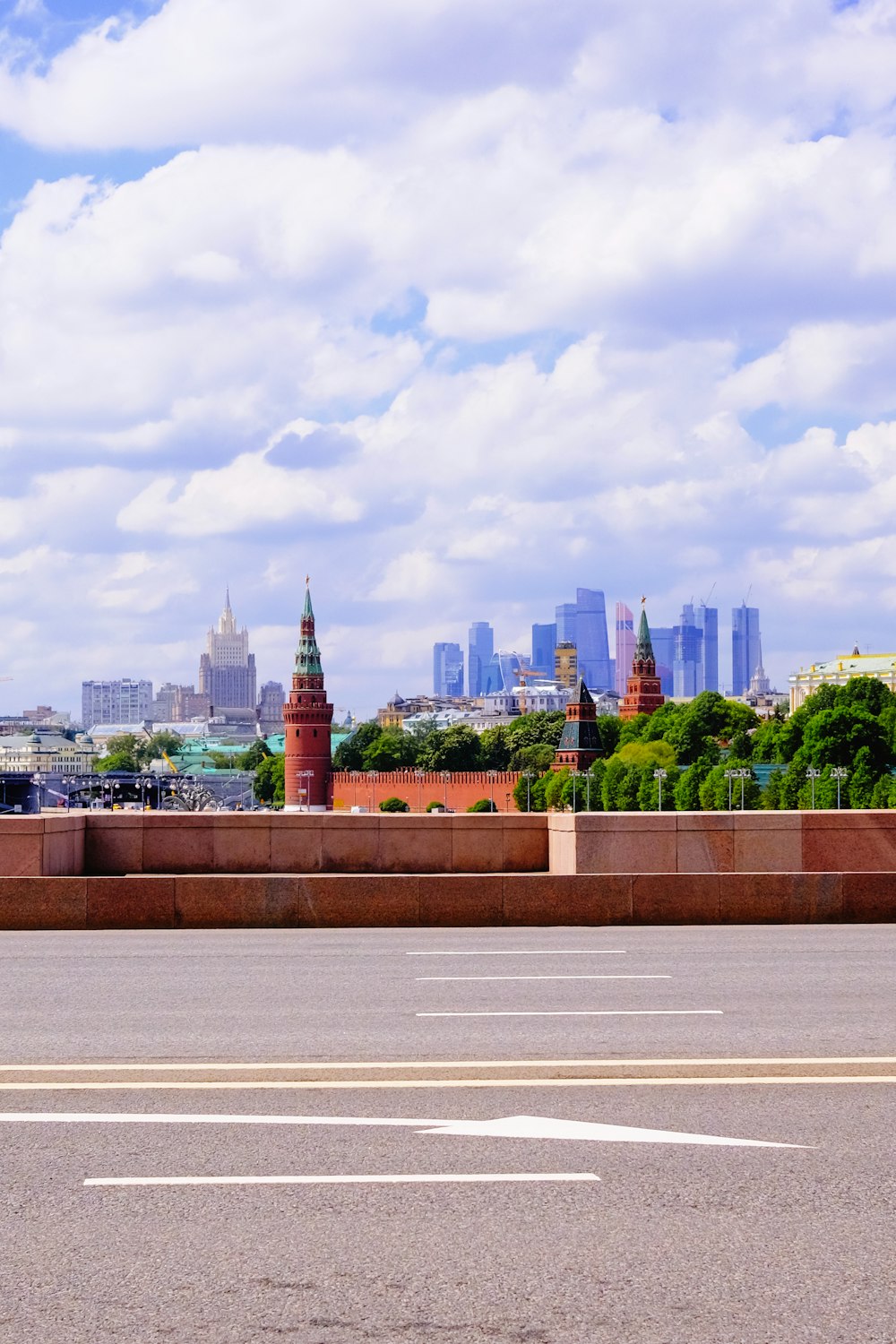 city skyline under white clouds during daytime