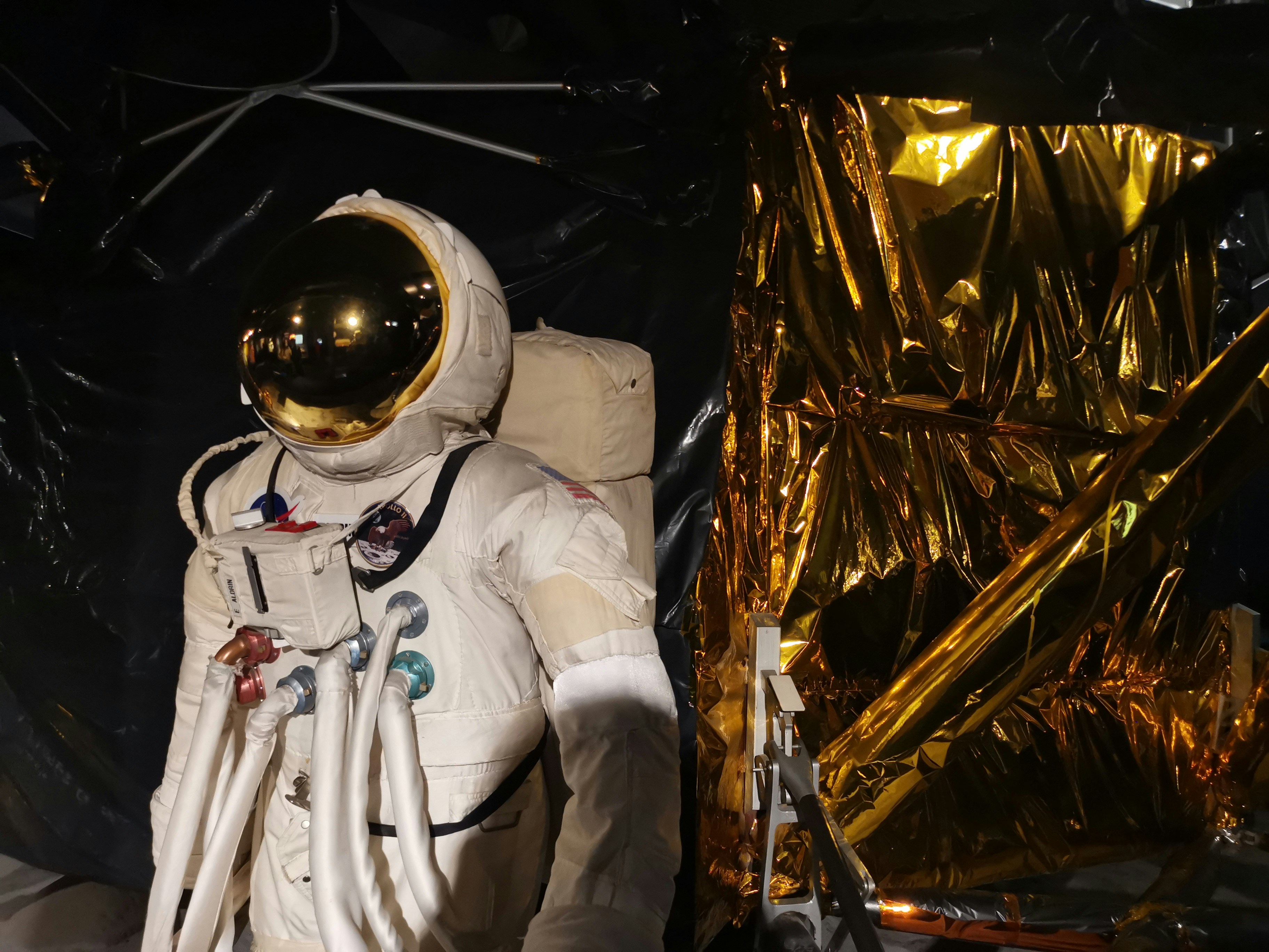 man in white suit wearing white helmet, 