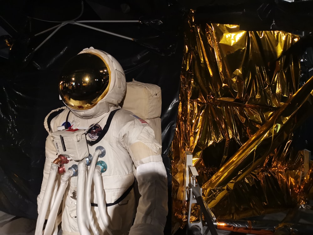 man in white suit wearing white helmet