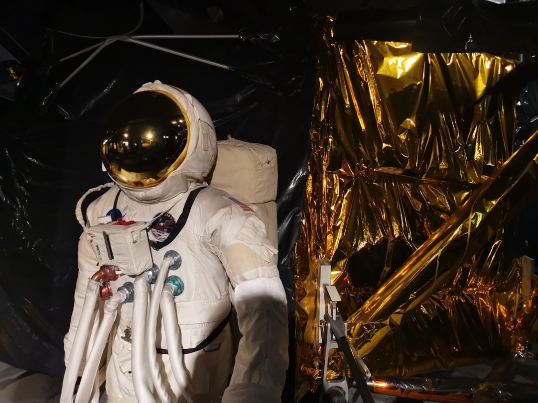 man in white suit wearing white helmet,