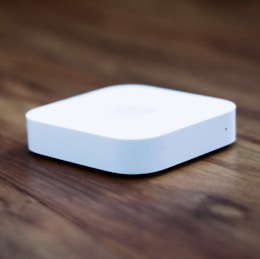 white apple tv on brown wooden table