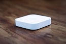 white apple tv on brown wooden table