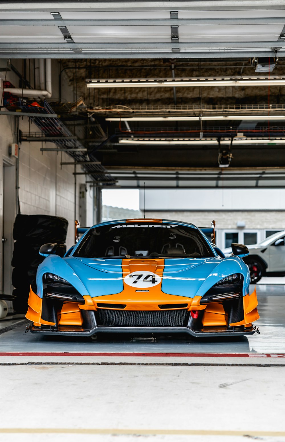orange lamborghini aventador parked in garage