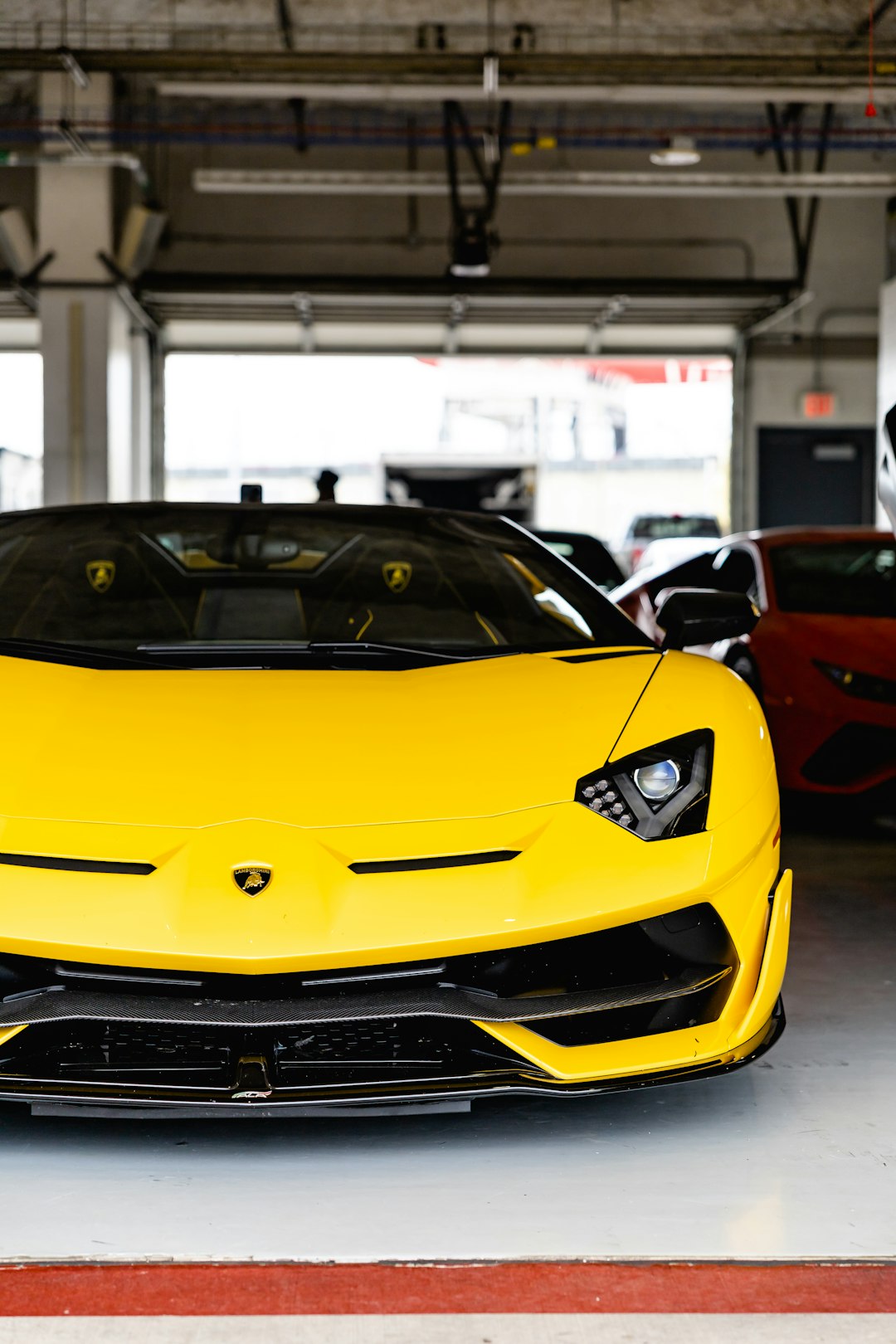 yellow lamborghini aventador parked in a parking lot