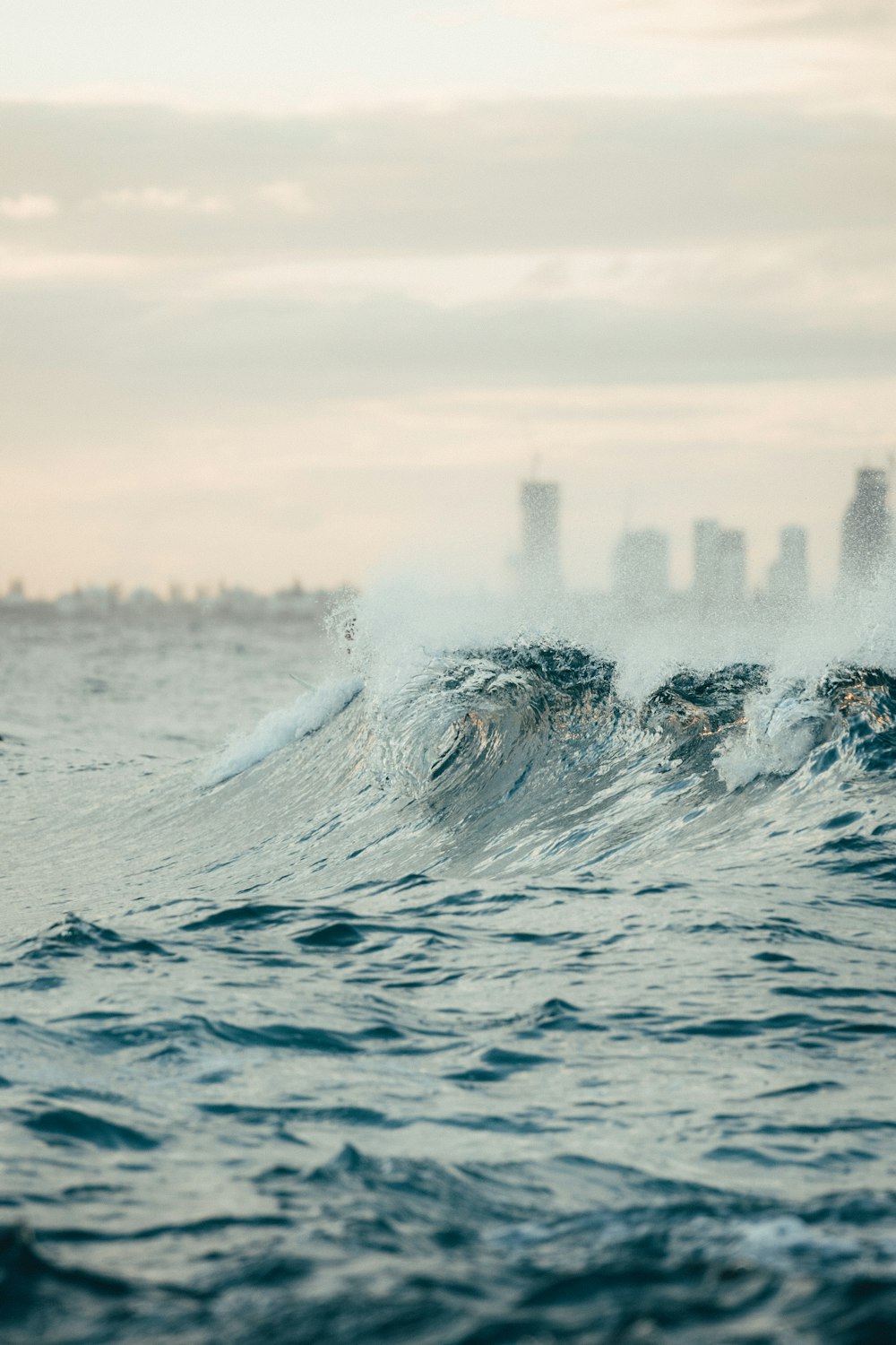 water splash on body of water during daytime