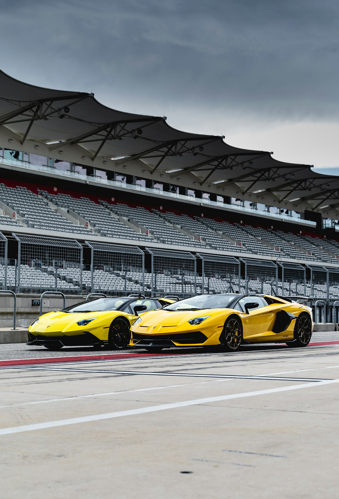 yellow ferrari sports car on track field