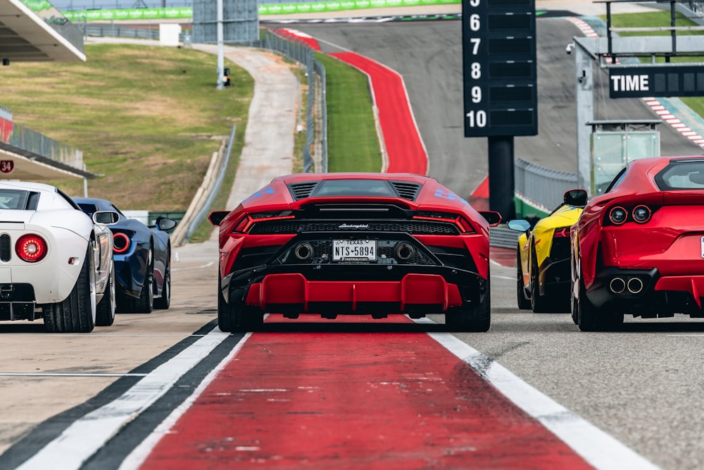 red and black ferrari f 1 on track