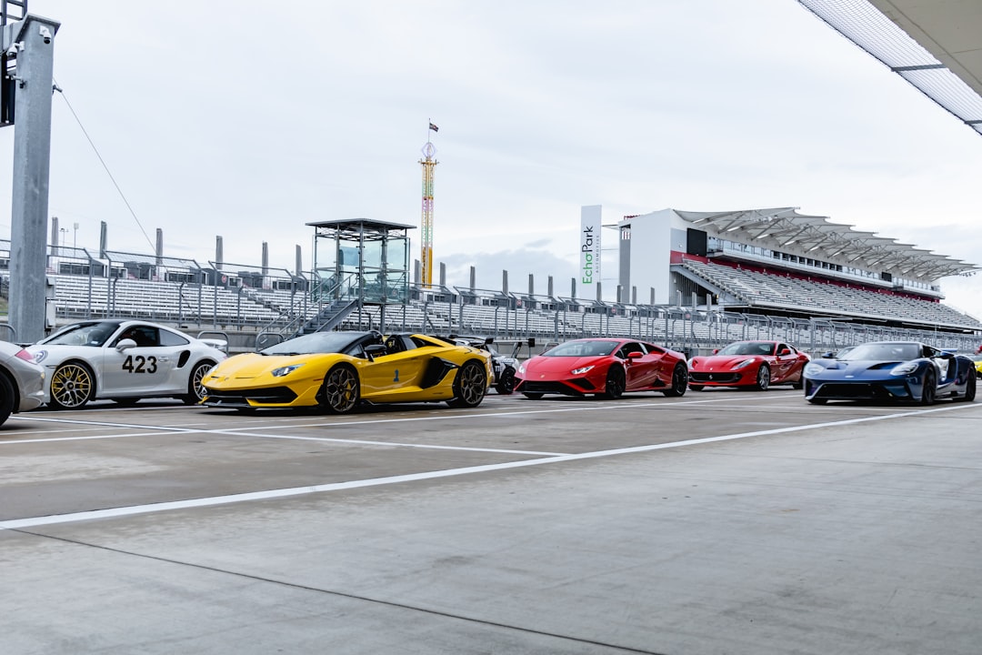 red and yellow cars on road during daytime