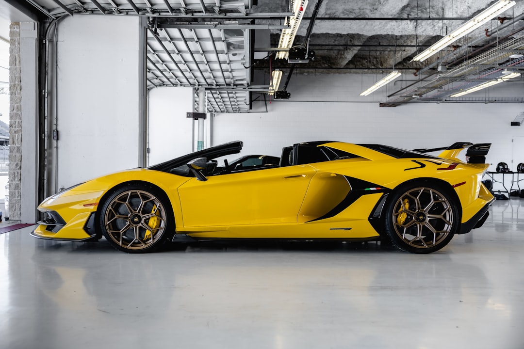 yellow ferrari 458 italia parked inside building