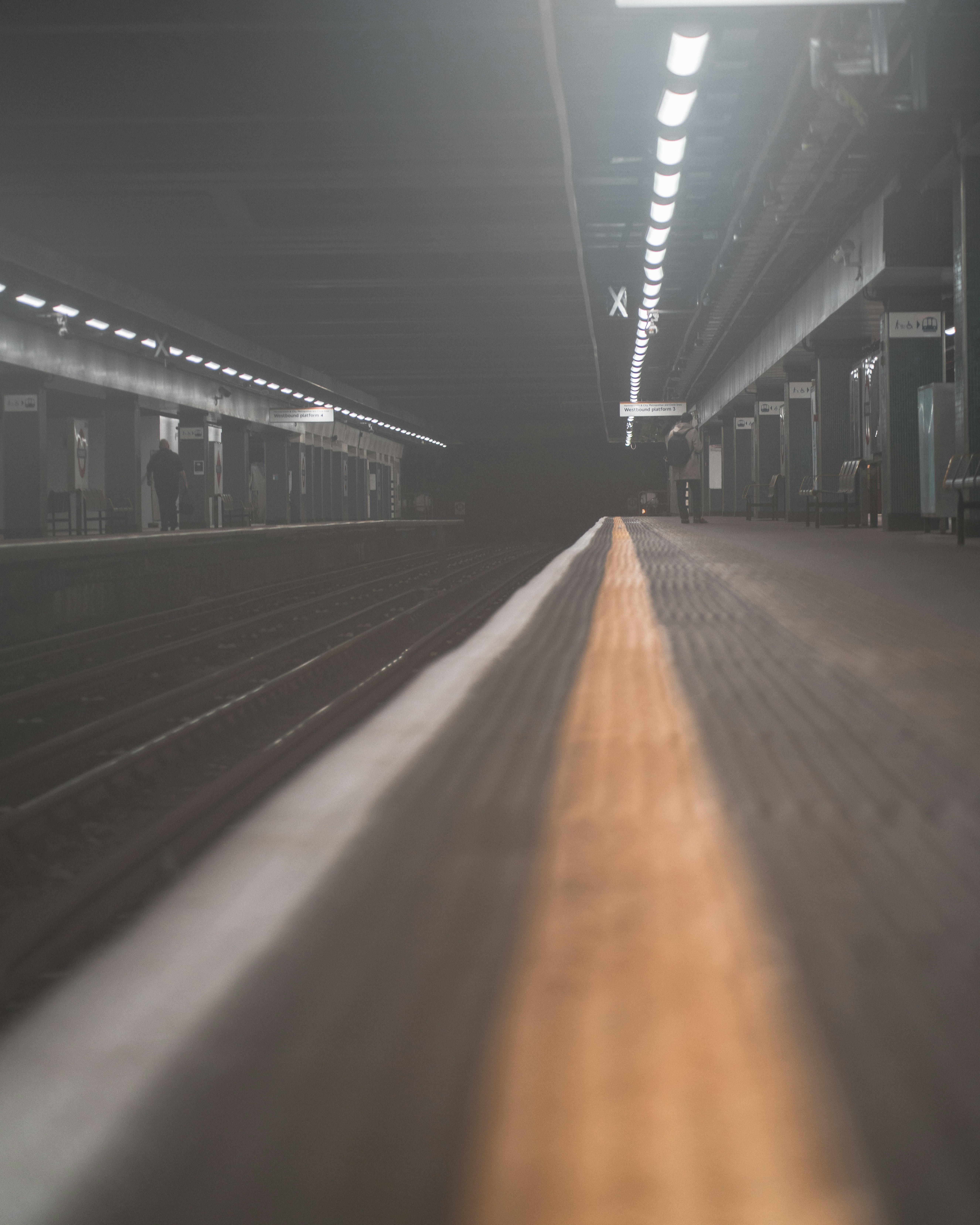 train station with lights turned on during night time