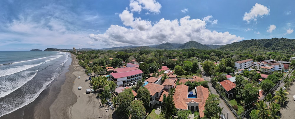 green trees and brown houses under white clouds and blue sky during daytime