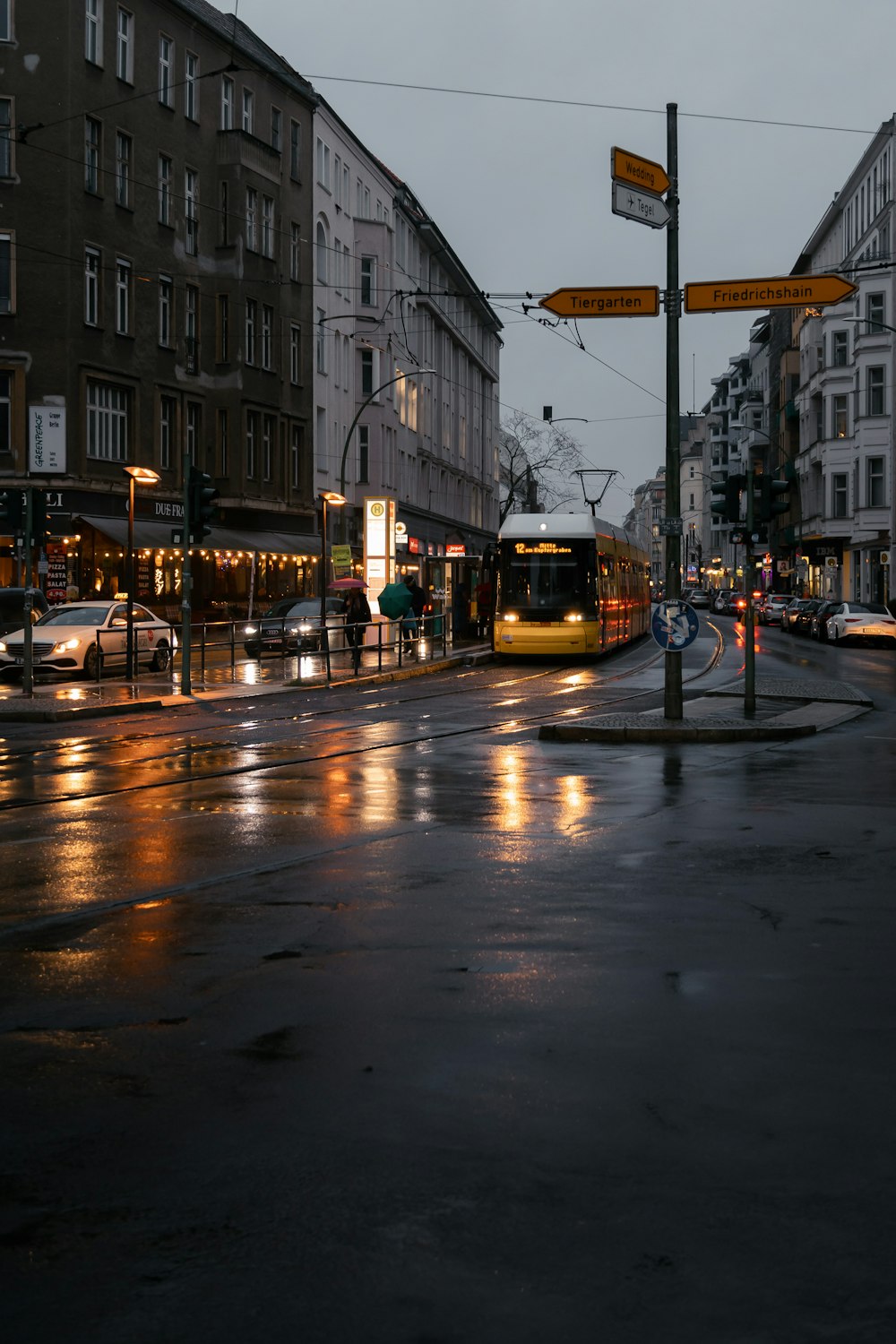 yellow and black tram on road during night time