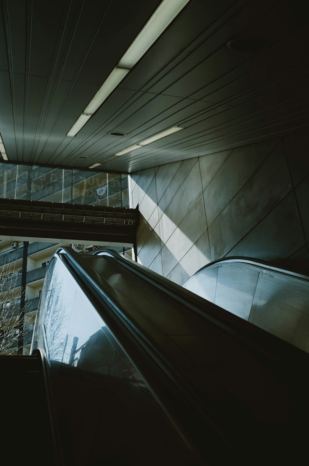 black escalator inside a building