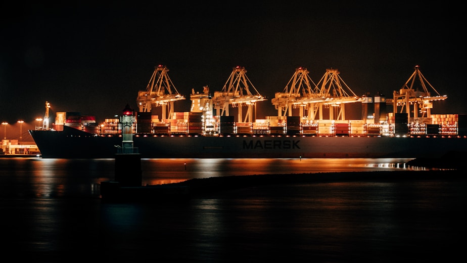 cargo ship on dock during night time