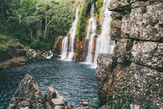 water falls on rocky mountain
