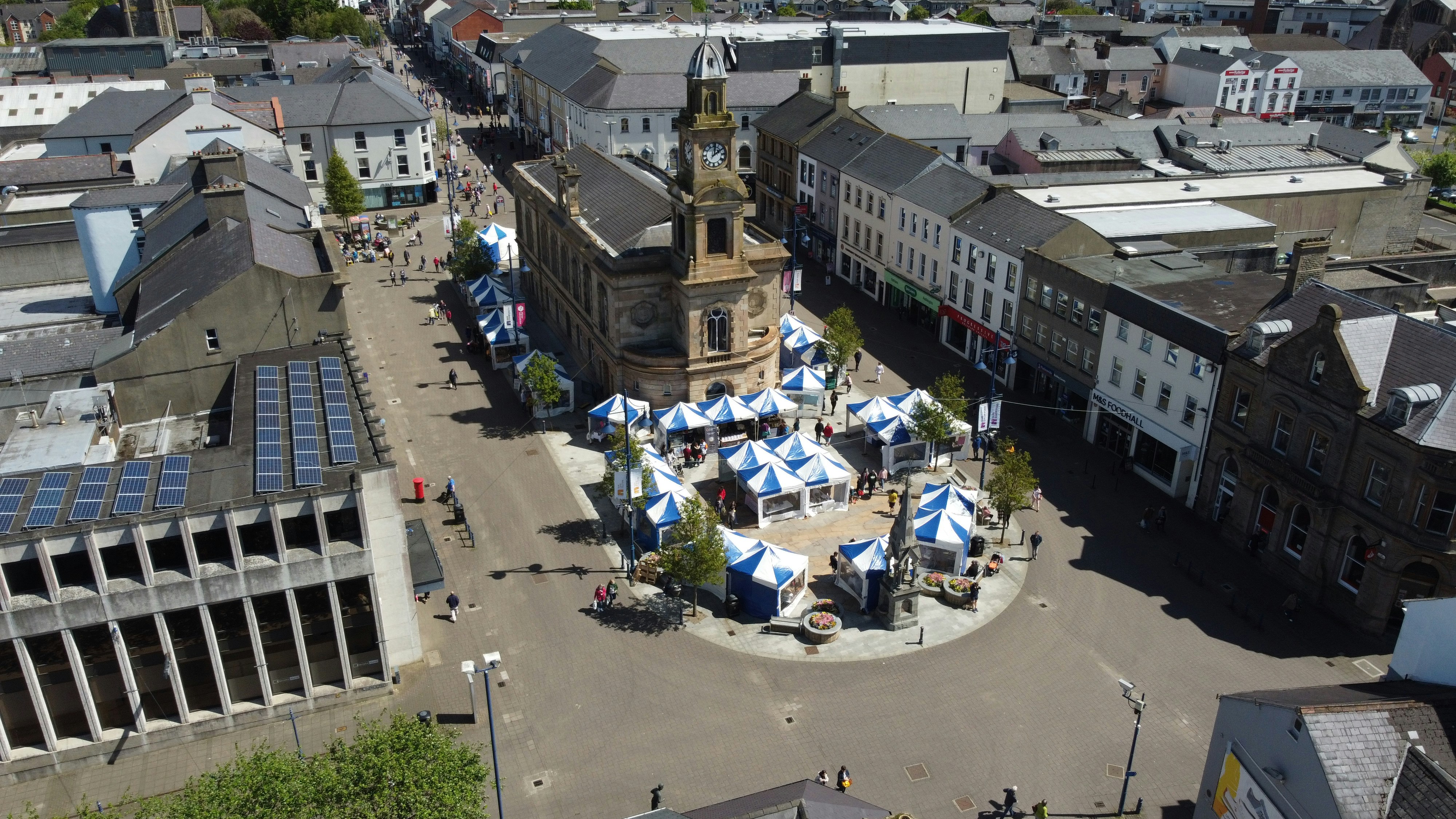 people walking on street near buildings during daytime