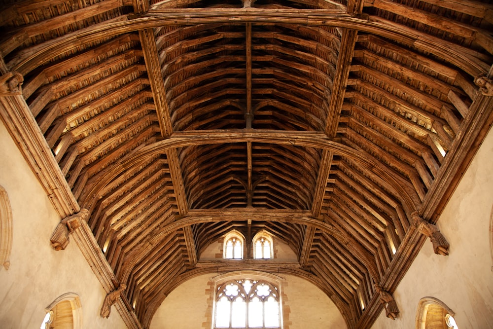 brown wooden ceiling with white ceiling lamp