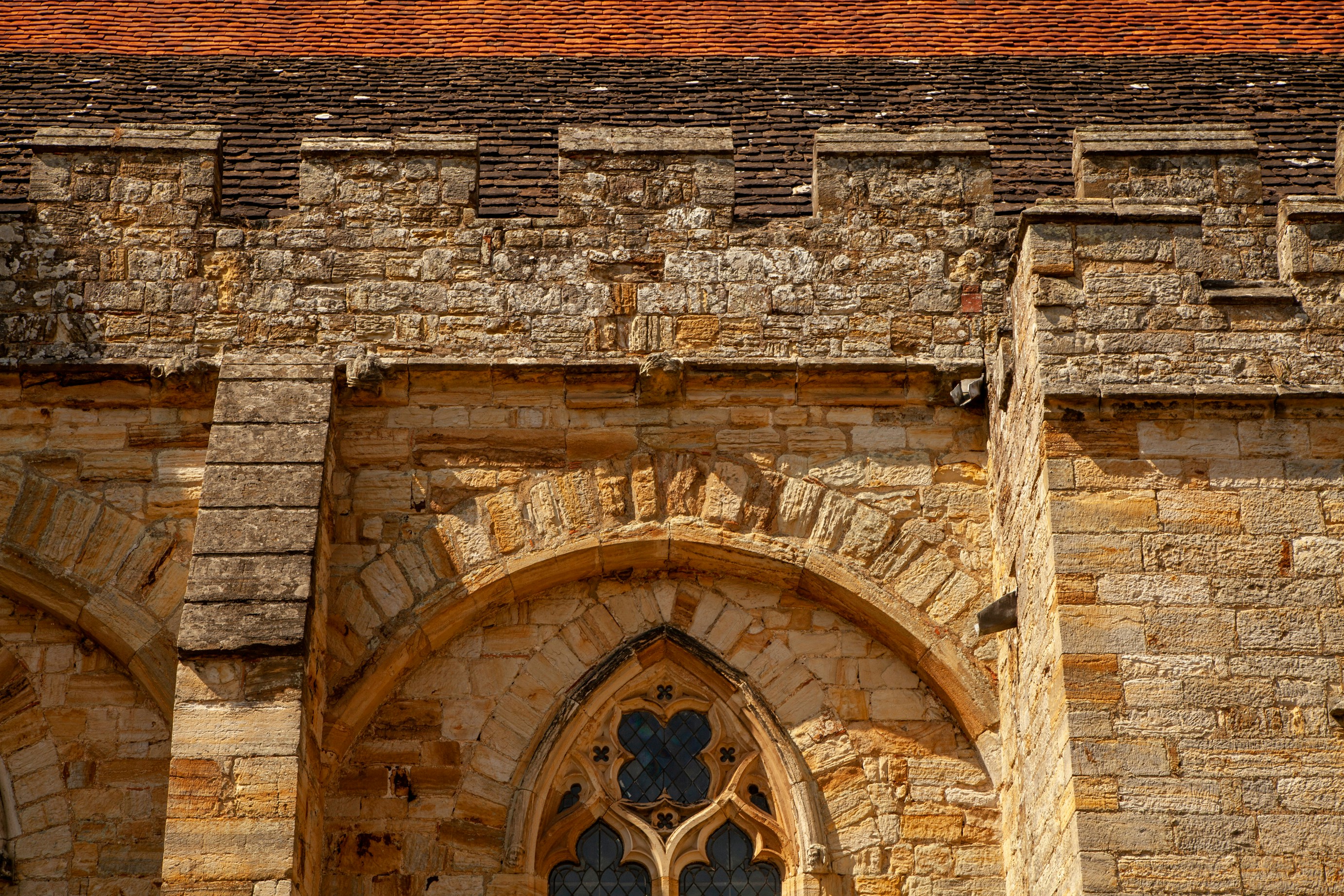 brown brick building with brown wooden door